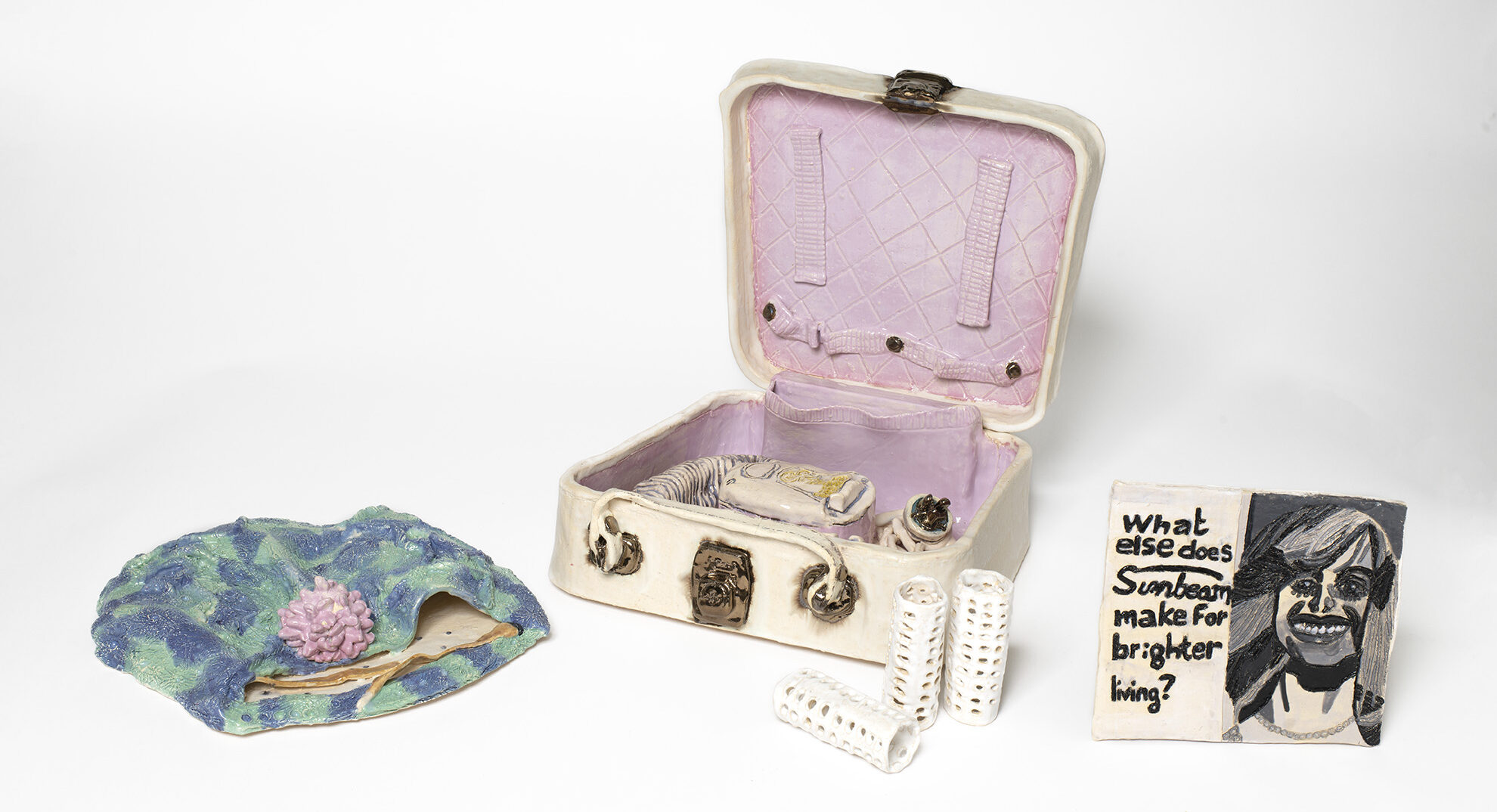 Lisa Reid ceramic artwork. Title: 1950s vintage Sunbeam electrical hairdryer. 2023, glaze, earthenware on ceramic. Dimensions 35 x 50 x 40 cm