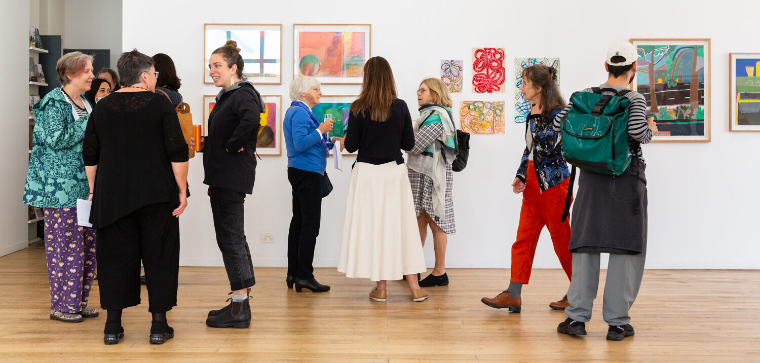 People at the opening of Sensitive Antennae at Arts Project Australia Collingwood Yards gallery.