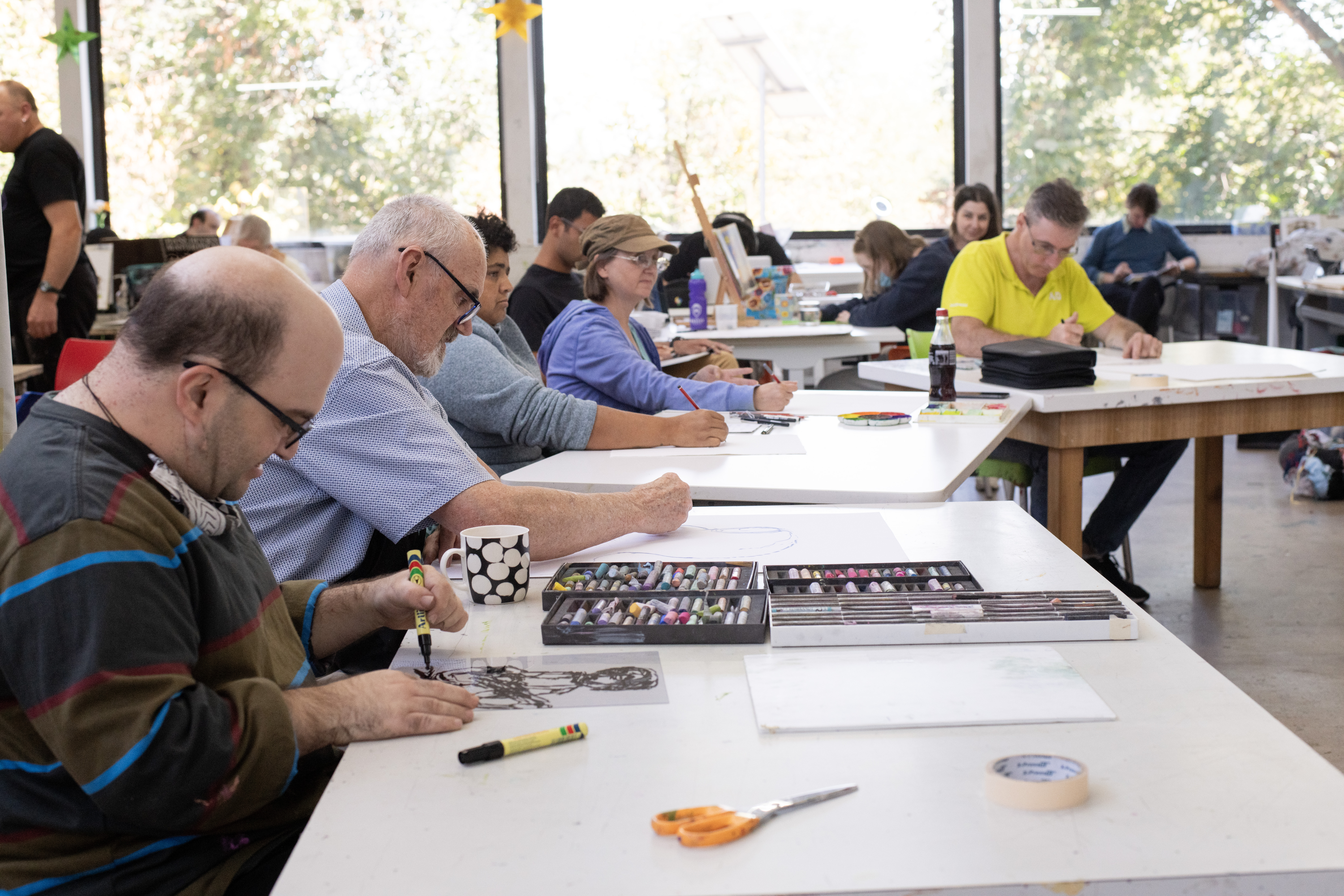 APA artists drawing Janet English during her sitting in the Northcote studio.